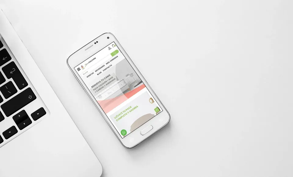 Mobile version of ALS Colchonerías' website on a smartphone next to a laptop