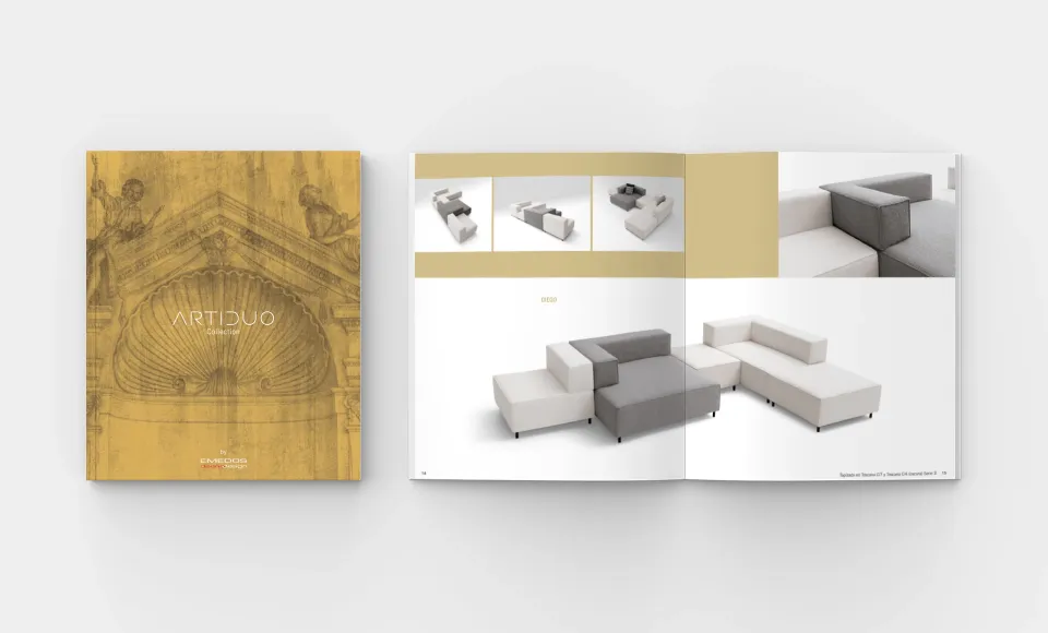 Emedos' Artiduo catalogue closed next to an open spread with a grey modular sofa