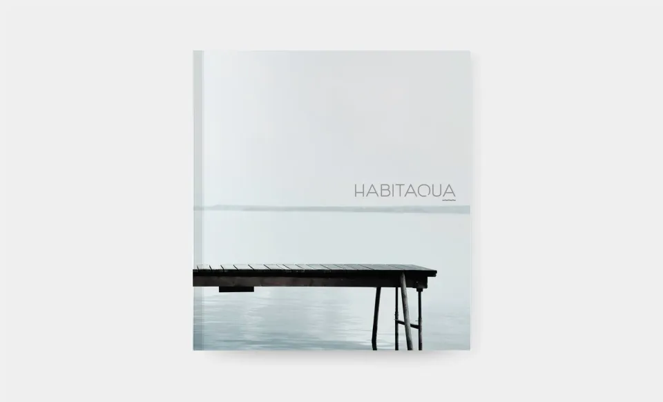Cover of the Habitacua catalogue featuring a photo of a jetty over the water