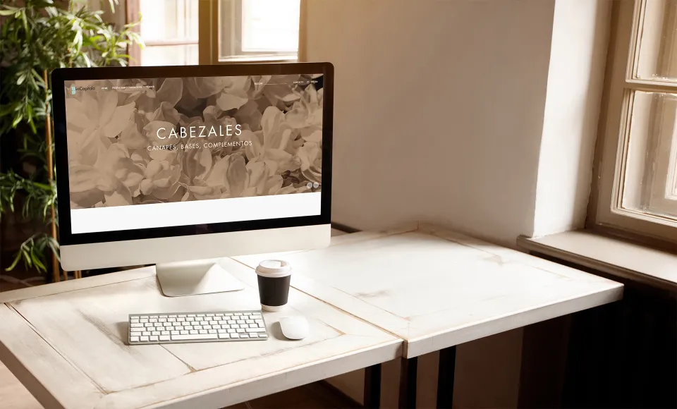 Computer showing LaCapitala's website 'Headboards' page, on a desk