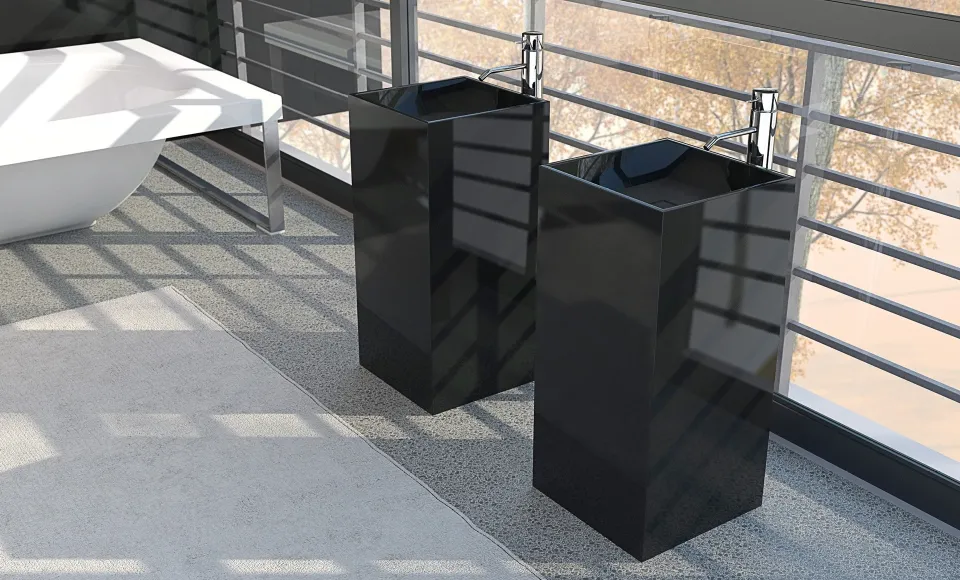 Two black pedestal basins beside a glazed terrace overlooking trees