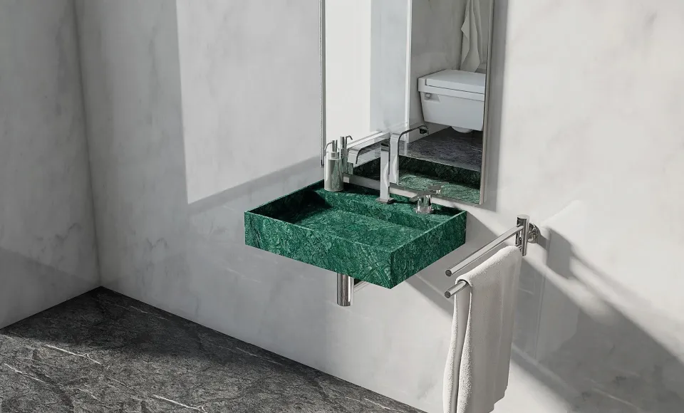 Green marble wall-hung basin beneath a mirror, with a towel rail beside the bathtub
