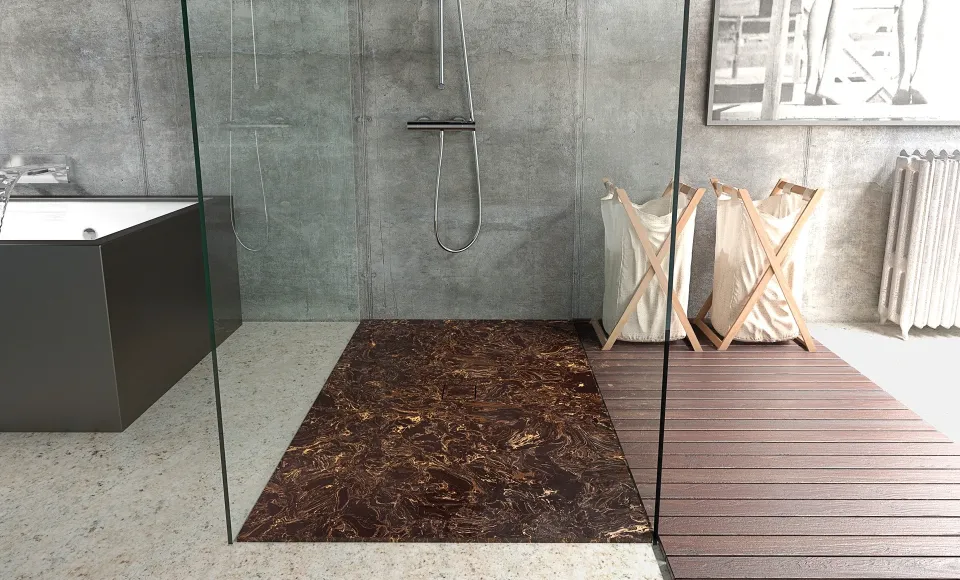 Dark marble shower tray inside a glass enclosure, next to a bathtub and wicker laundry baskets