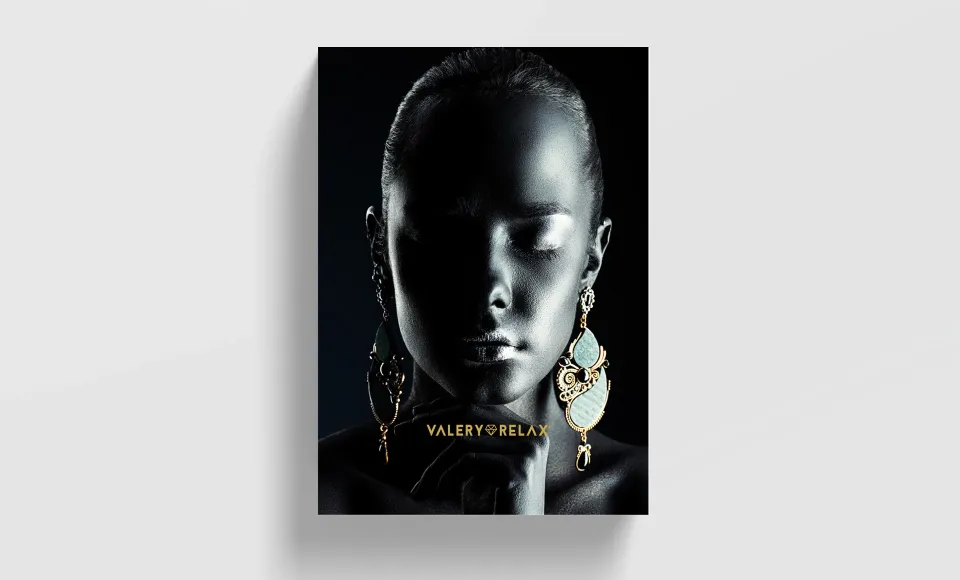 Valery Relax poster featuring a woman's face and statement earrings
