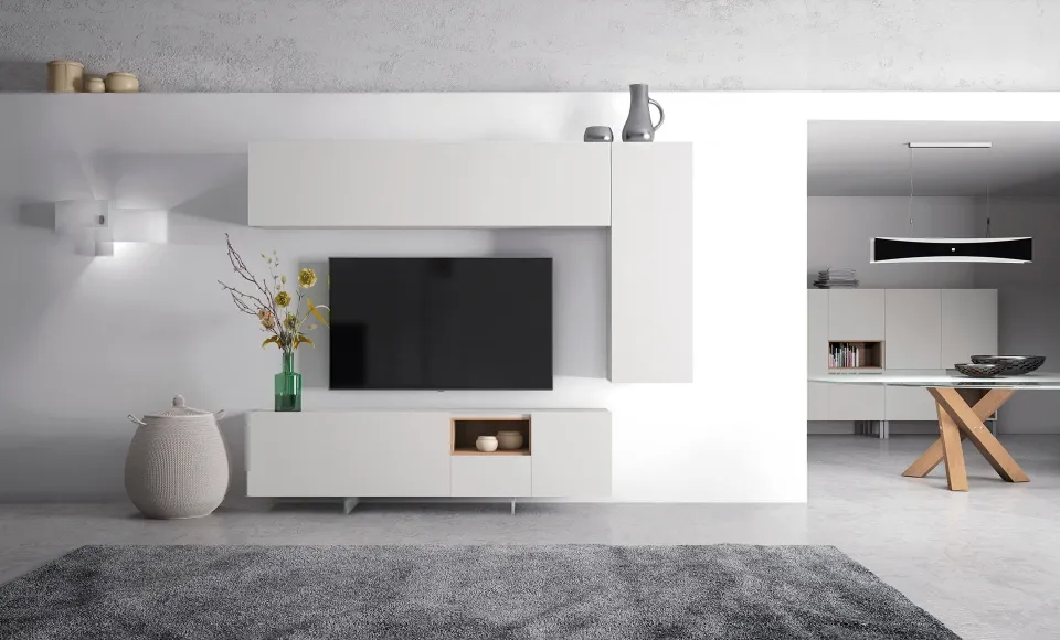 Salón con mueble modular blanco, puf redondo y un jarrón con flores