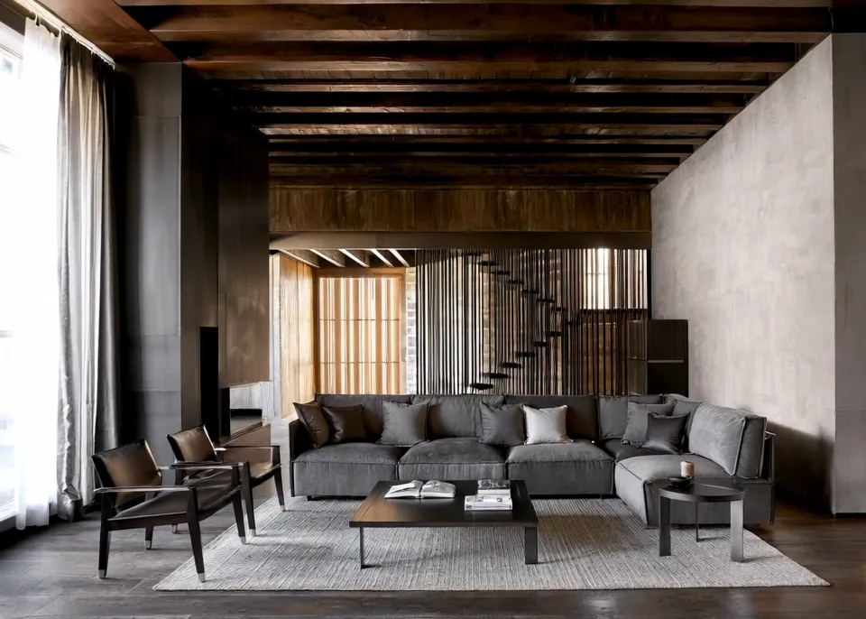Two videos created from a single image: a living room with a grey modular sofa and a wooden beamed ceiling.
